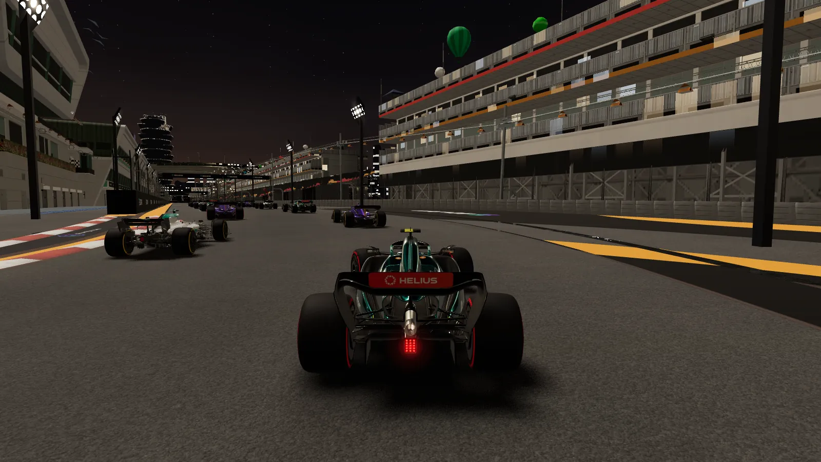 Night race on a street circuit: the player's car, seen from behind, on a floodlit grid with rivals ahead